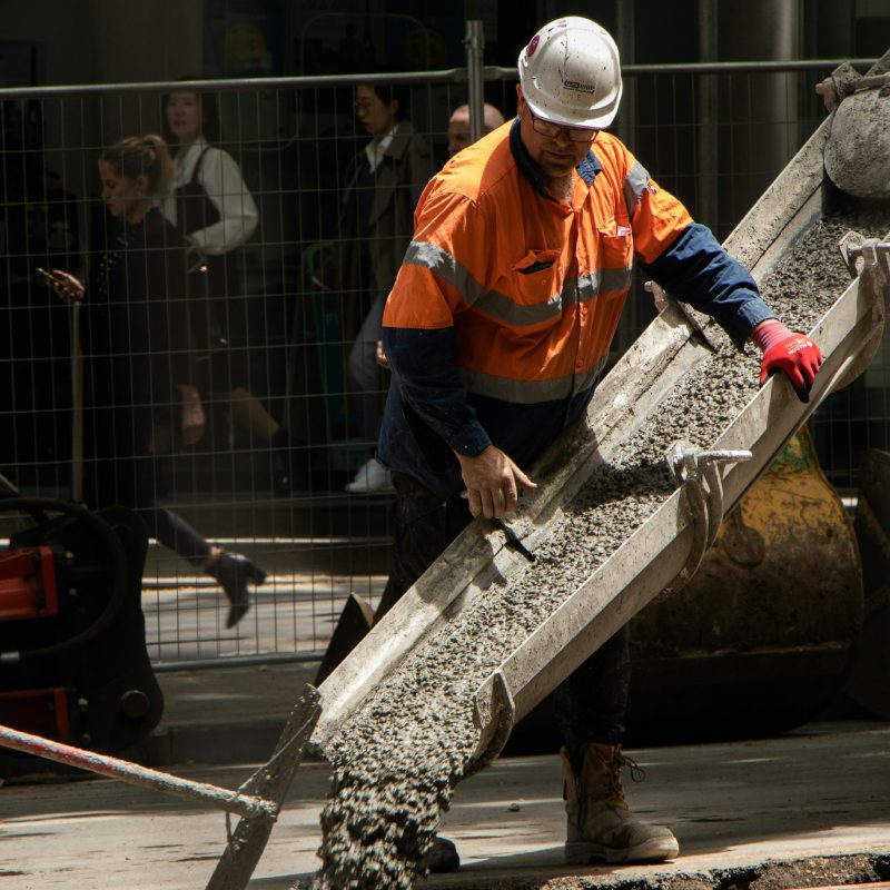 Construction worker pouring concrete mix