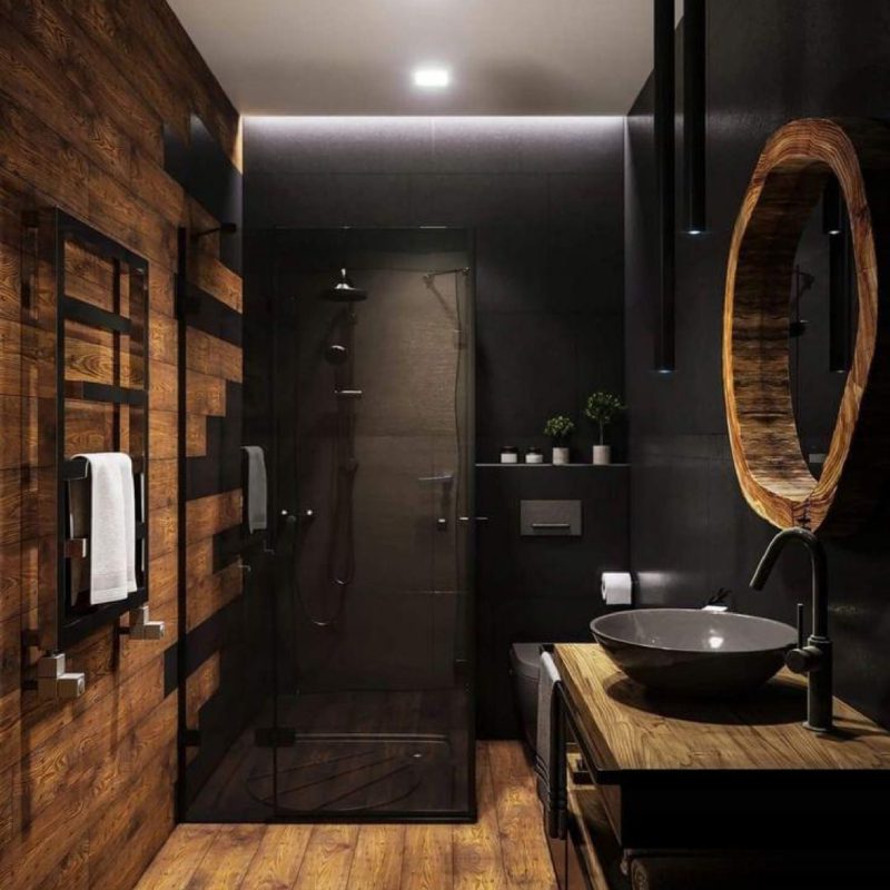 Bathroom with wooden walls and floor, creating a warm and cozy atmosphere.