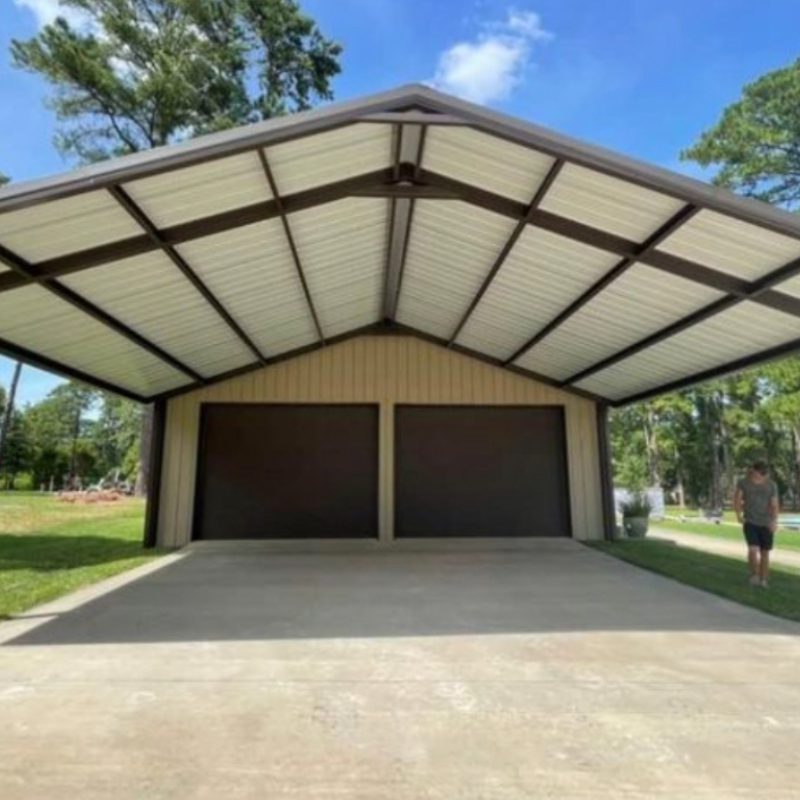 A garage with a metal roof and two doors, providing shelter for vehicles and storage space.